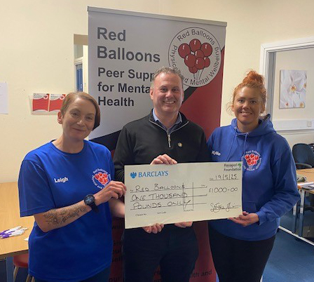 Red Balloons are presented with a cheque from the Resapol Foundation